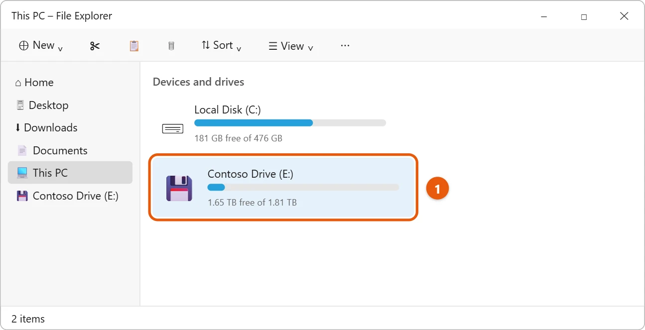 How to Use a WD easystore Drive on Windows 11 1 Illustration of File Explorer This PC showing the local disk and an external drive highlighted under Devices and drives