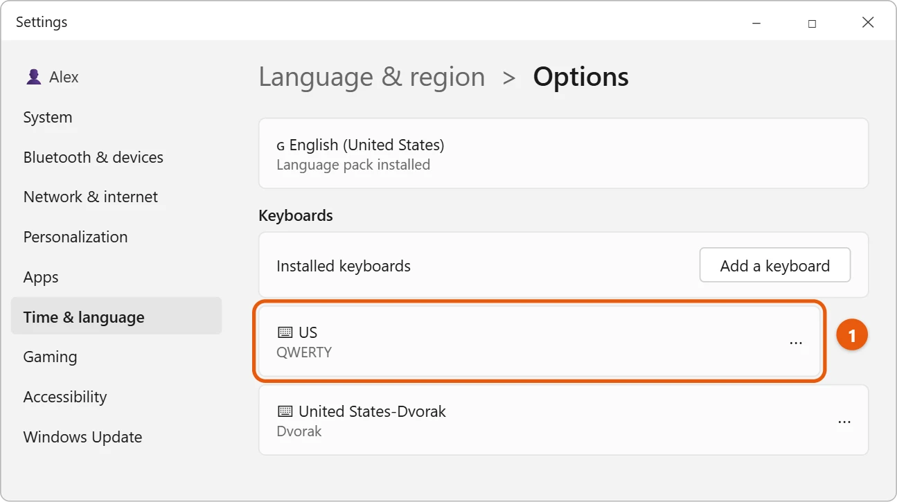 How to Fix WASD Swapped with Arrow Keys in Windows 11 2 Illustration of Windows 11 Settings Language options with the US QWERTY keyboard highlighted under Keyboards and a second keyboard layout listed below it