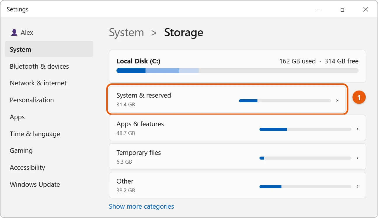 How Much Space Does Windows 11 Take Up? 2 Illustration of Windows 11 Settings System Storage page with the C drive usage bar and the System and reserved category highlighted